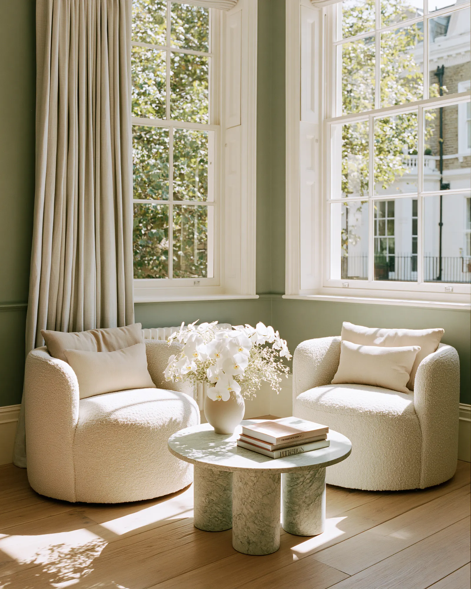 A refined private clinic interior in warm bone and greige tones